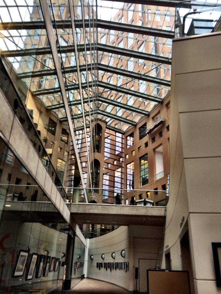 Inside the covered foyer of the Vancouver Public Library Central Branch
