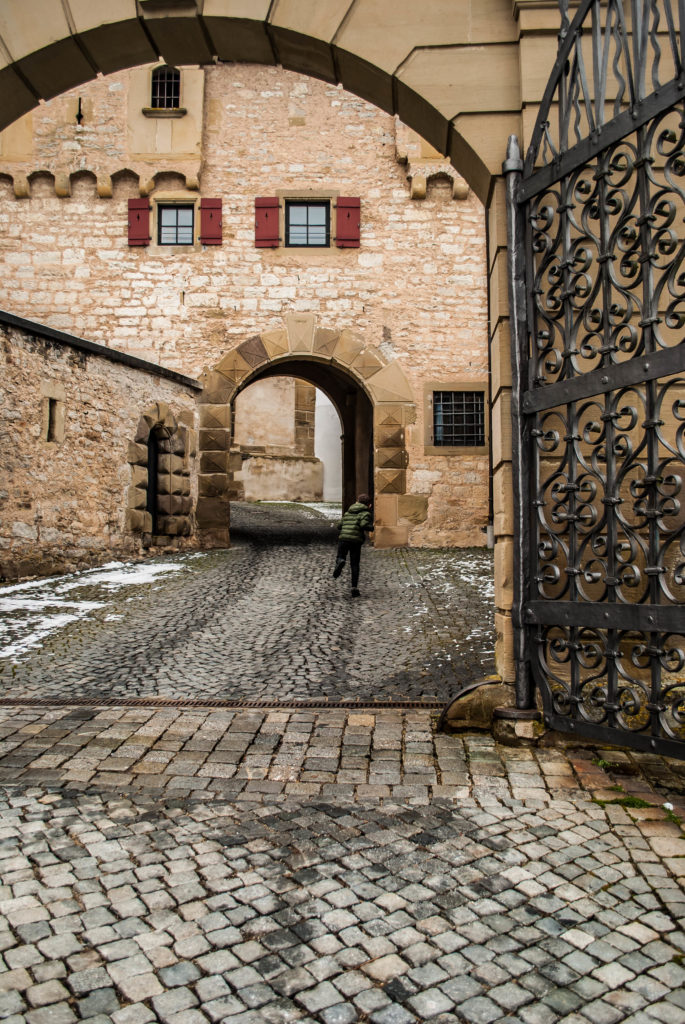 My son running into the monastery gates